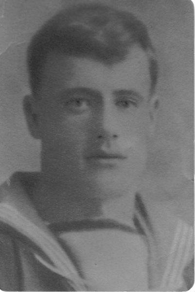 Young man in sailor uniform, black and white photograph.
