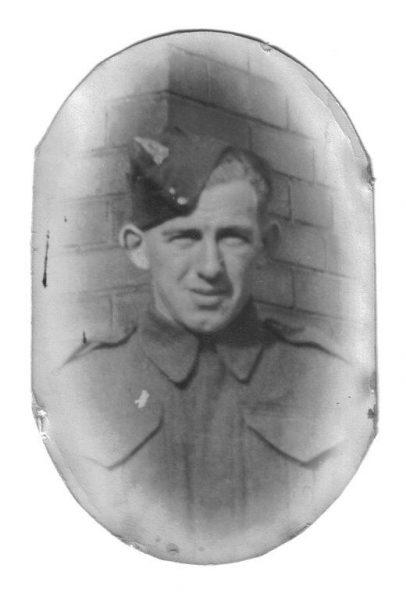 Black and white portrait of a man in military uniform.