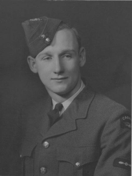 Black and white portrait of a man in a military uniform and cap.