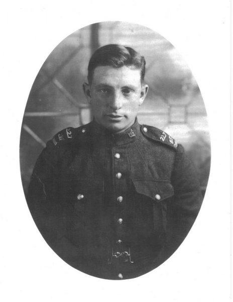Black and white photo of a man in a military uniform.