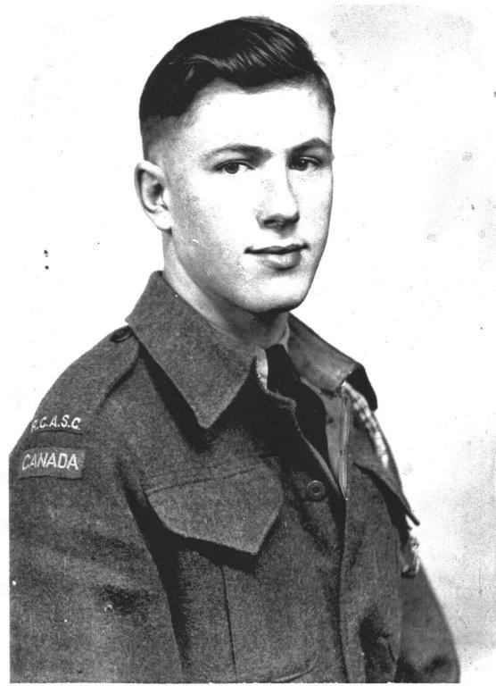 Young man in a military uniform, black and white photograph.