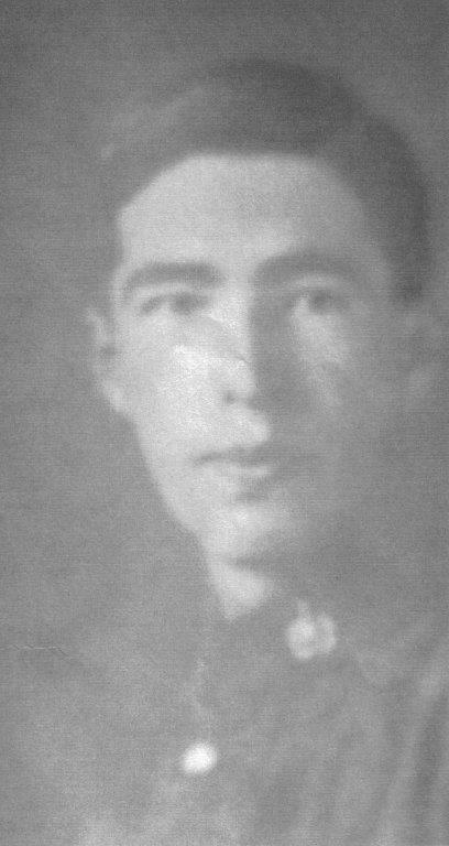 Faded black-and-white portrait of a young man in uniform.