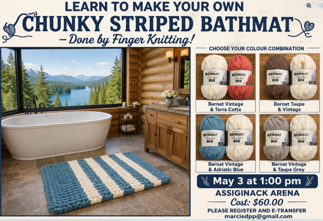 oval bath with a blue and white striped chunky wool bathmat in front of it. 