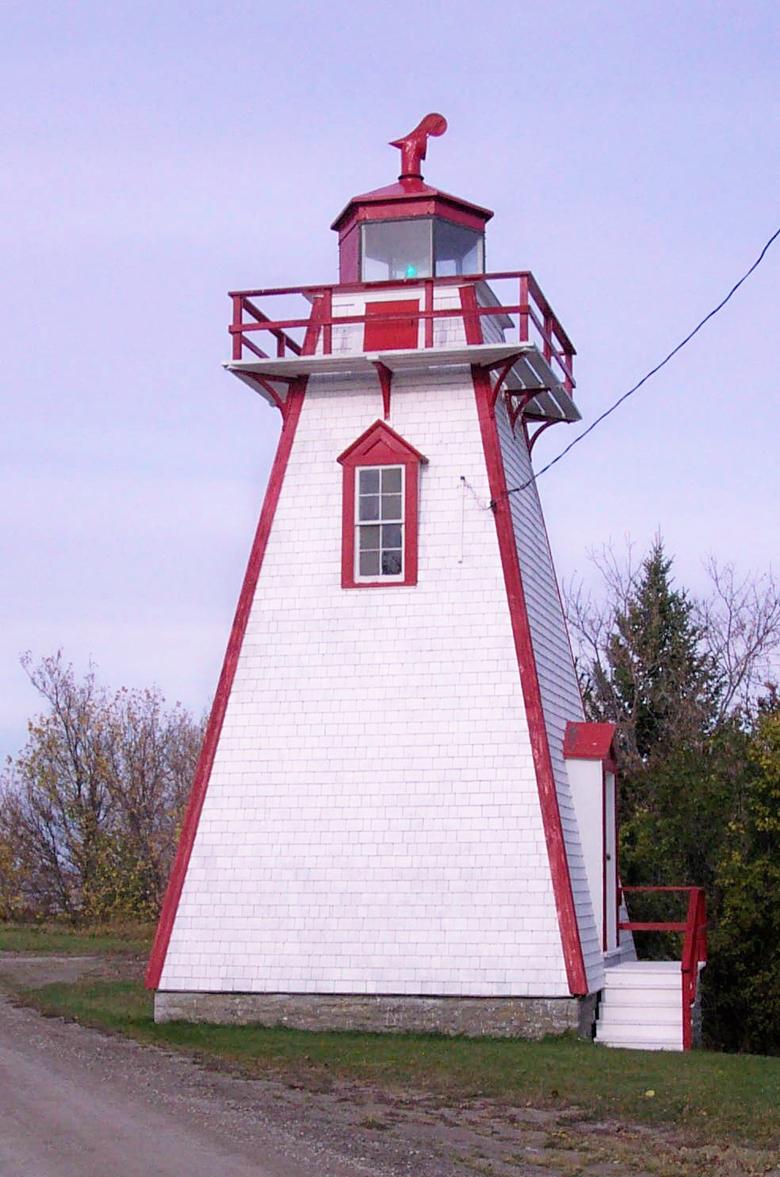red and white square light house tower.